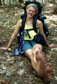 isis rests on the trail showing strong, dirty soles